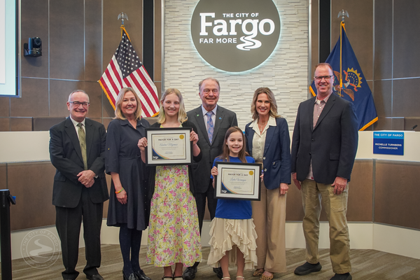 Fargo City Commission with Contest Winners Aubrie Myrmoe and Laila Wangen