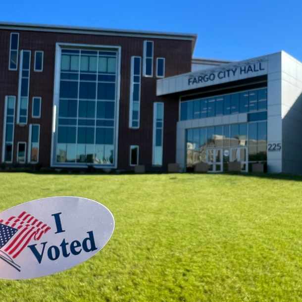 An "I voted" sign is seen on the lawn in front of Fargo City Hall.