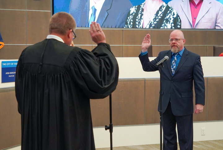 City Commissioner Chad Peterson takes the oath of office.