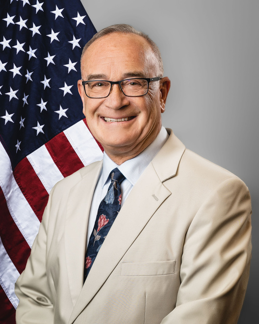 Fargo City Commissioner John Strand - Flag Background (Vertical)