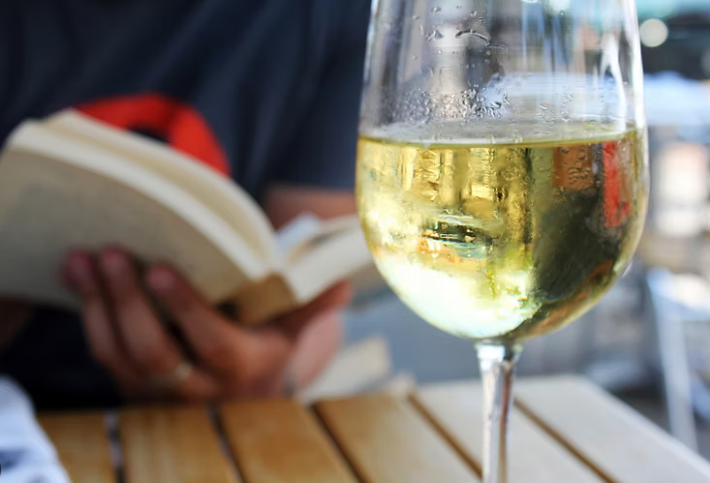 Silent Reading Party book and wine glass